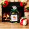 Nana's Apple Pie Potpourri by Irish Twins Potpourri sits on a wooden table in front of a fireplace with Christmas stockings and ornaments.